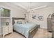 Main bedroom with a tray ceiling and a decorative chandelier at 119 Winterberry St, Mooresville, NC 28117
