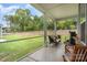 A serene screened-in patio, perfect for relaxing and enjoying the backyard view at 119 Winterberry St, Mooresville, NC 28117