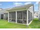 Spacious screened-in patio offers an ideal spot for dining and relaxing in a private outdoor setting at 119 Winterberry St, Mooresville, NC 28117