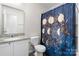 Bathroom featuring a single sink vanity and a shower with a blue decorative curtain at 1475 Cypress Loop # 29, Newton, NC 28658