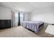 Bedroom with neutral carpeting, a window with curtains, and a bed with purple bedding at 1475 Cypress Loop # 29, Newton, NC 28658