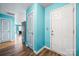 Bright entryway with blue walls, brown floors, and a view into the living area at 1475 Cypress Loop # 29, Newton, NC 28658