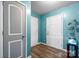 Light-filled entryway with modern lighting, wood-look floors and blue walls at 1475 Cypress Loop # 29, Newton, NC 28658
