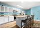 Eat-in kitchen featuring white cabinets, granite countertops, stainless steel appliances, and barstool seating at 1475 Cypress Loop # 29, Newton, NC 28658