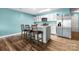 Bright kitchen with stainless steel appliances, granite counters, white cabinets, and barstool seating at 1475 Cypress Loop # 29, Newton, NC 28658