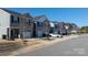 A row of townhomes with attached garages along a street at 1475 Cypress Loop # 29, Newton, NC 28658