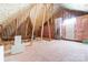 Unfinished attic space, featuring exposed insulation and wooden beams at 148 Castle Dr, Mooresville, NC 28117
