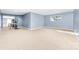 Large basement space with ample room, plush carpeting, and fitness equipment at 148 Castle Dr, Mooresville, NC 28117