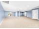 Spacious basement with neutral carpet, natural light, and potential for various uses at 148 Castle Dr, Mooresville, NC 28117