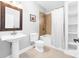 Well-lit bathroom featuring a shower-tub combo with white fixtures at 148 Castle Dr, Mooresville, NC 28117