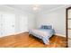 Bedroom featuring hardwood floors, ceiling fan, and great natural light at 148 Castle Dr, Mooresville, NC 28117