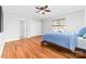 Bright bedroom with hardwood flooring, ceiling fan, and ensuite bath at 148 Castle Dr, Mooresville, NC 28117