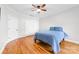 Bedroom featuring hardwood floors, ceiling fan, and closet at 148 Castle Dr, Mooresville, NC 28117
