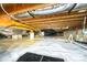 Clean crawl space with vapor barrier, wooden beams, insulated pipes, and other mechanical features at 148 Castle Dr, Mooresville, NC 28117