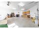 Uncluttered garage interior featuring cabinets, lighting, and concrete flooring at 148 Castle Dr, Mooresville, NC 28117