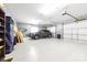 Clean, organized garage with epoxy flooring, car parking, and storage space at 148 Castle Dr, Mooresville, NC 28117