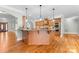 Open concept kitchen with wood cabinetry, granite countertops, and a view to front entrance at 148 Castle Dr, Mooresville, NC 28117