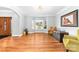 Living room with wood flooring, large bay windows, neutral paint, and elegant furnishings at 148 Castle Dr, Mooresville, NC 28117