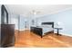 Bright main bedroom with hardwood floors, a ceiling fan, and ample space with a large ensuite bathroom at 148 Castle Dr, Mooresville, NC 28117