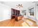 Home office with custom wood desk, built-in bookcase, and sun-filled windows at 148 Castle Dr, Mooresville, NC 28117