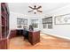 Bright home office featuring a ceiling fan, beautiful wood built-ins, and lots of natural light at 148 Castle Dr, Mooresville, NC 28117