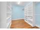Spacious walk-in closet with custom shelving and wood floors at 148 Castle Dr, Mooresville, NC 28117