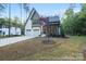 Beautiful exterior elevation of a home with a two-car garage and neatly landscaped front yard at 19155 Newburg Hill Rd, Davidson, NC 28036