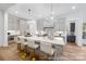 Bright and airy kitchen with a large island, modern appliances, and stylish pendant lighting at 19155 Newburg Hill Rd, Davidson, NC 28036