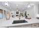 Gourmet kitchen with a central island, a modern faucet, and views into the living room at 19155 Newburg Hill Rd, Davidson, NC 28036