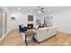 Cozy living room featuring a fireplace, comfortable seating, and hardwood flooring at 19155 Newburg Hill Rd, Davidson, NC 28036