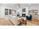 Comfortable living room with fireplace, hardwood floors, and sliding glass doors to the outdoor space at 19155 Newburg Hill Rd, Davidson, NC 28036