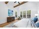Spacious bedroom with vaulted ceilings, exposed wood beams, and many large windows at 19155 Newburg Hill Rd, Davidson, NC 28036