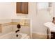 Clean bathroom featuring a bathtub, tile, and updated fixtures at 2004 Grandhaven Dr, Concord, NC 28027
