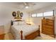 Charming bedroom with a wooden dresser and ceiling fan at 2004 Grandhaven Dr, Concord, NC 28027