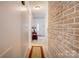 Inviting entryway with brick accent wall and a view to the front door at 2004 Grandhaven Dr, Concord, NC 28027