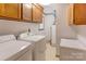 Bright laundry room with washer, dryer, cabinets, and ample storage at 2004 Grandhaven Dr, Concord, NC 28027