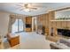 Living area with a brick fireplace and built-in shelving unit at 2004 Grandhaven Dr, Concord, NC 28027