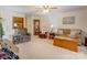 Comfortable living room features a wood coffee table and plush seating at 2004 Grandhaven Dr, Concord, NC 28027