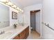 Bright bathroom with double sinks, updated fixtures, and shower with patterned curtain at 2050 Tite Rd, Stanfield, NC 28163