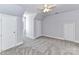 Carpeted bedroom with dormer window, ceiling fan, and white trim at 2050 Tite Rd, Stanfield, NC 28163