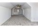 Spacious bonus room featuring vaulted ceilings, neutral carpet, and natural light at 2050 Tite Rd, Stanfield, NC 28163