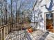 Wood deck overlooking trees with sliding glass doors to the house and a large potted plant at 2050 Tite Rd, Stanfield, NC 28163
