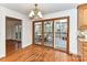 Bright dining area with wood floors and glass doors leading to the outdoor deck at 2050 Tite Rd, Stanfield, NC 28163