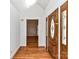 Elegant entryway featuring hardwood floors, a wooden front door, and a view into a bright living space at 2050 Tite Rd, Stanfield, NC 28163