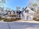 Beautiful home featuring a well-manicured lawn, circular driveway, attached garage, and covered front porch at 2050 Tite Rd, Stanfield, NC 28163