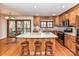 Bright, modern kitchen with stainless steel appliances, granite countertops, a kitchen island, and hardwood floors at 2050 Tite Rd, Stanfield, NC 28163