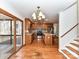 Open kitchen and dining area with hardwood floors and access to a screened-in porch at 2050 Tite Rd, Stanfield, NC 28163