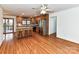 Open living room with fireplace, built-in shelving, and beautiful hardwood floors at 2050 Tite Rd, Stanfield, NC 28163