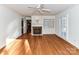 Bright and spacious living room with fireplace, built-in shelving and shuttered windows at 2050 Tite Rd, Stanfield, NC 28163