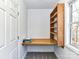 Efficient office nook with floating desk, built-in shelves, and natural light at 2050 Tite Rd, Stanfield, NC 28163